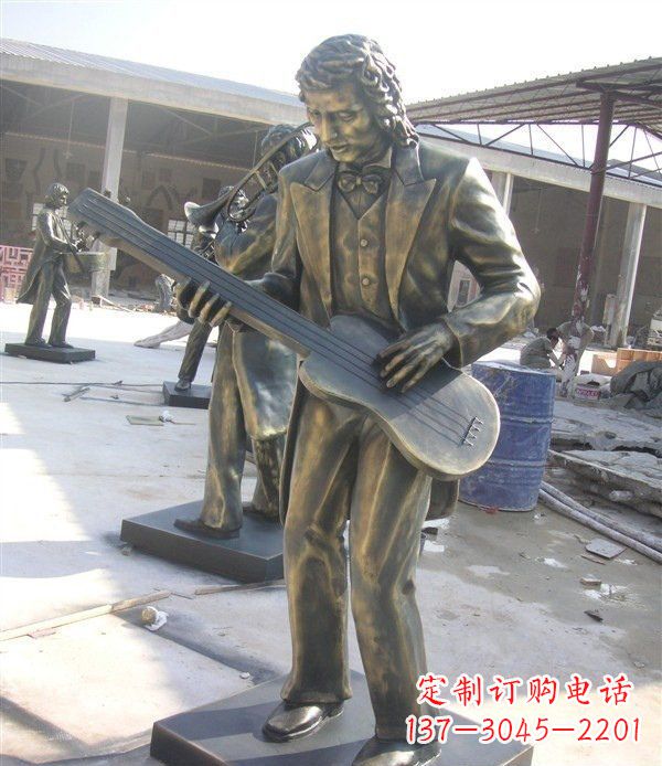 泰安西方人物铜吉他雕塑