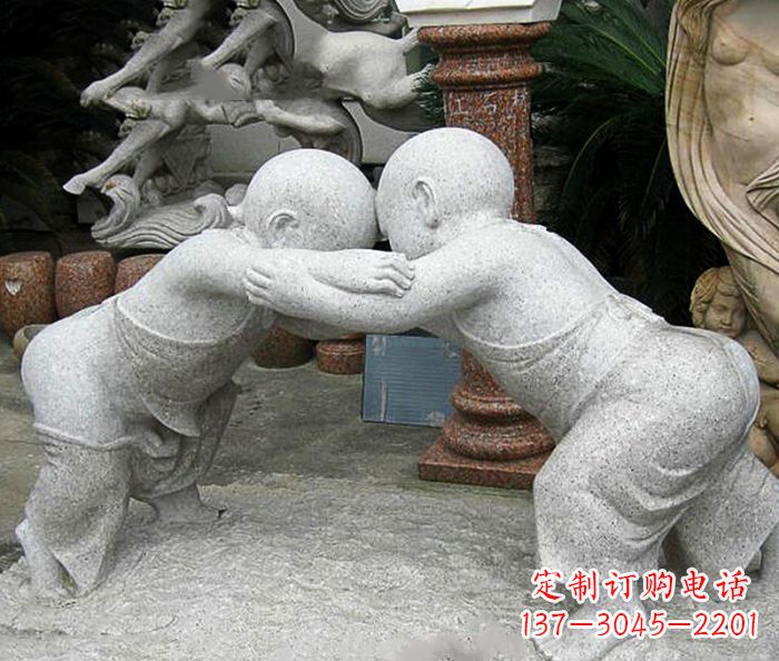 泰安可爱小孩摔跤石雕