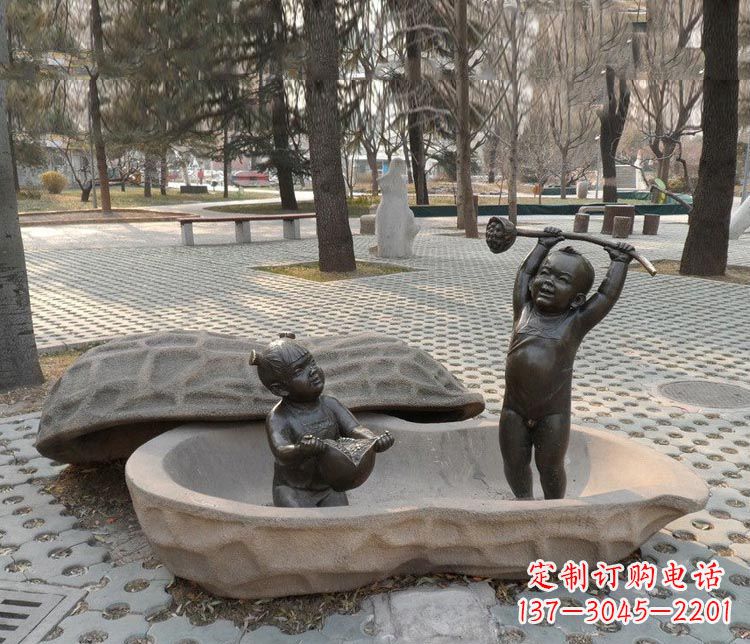 泰安拿莲蓬和石榴的小孩铜雕