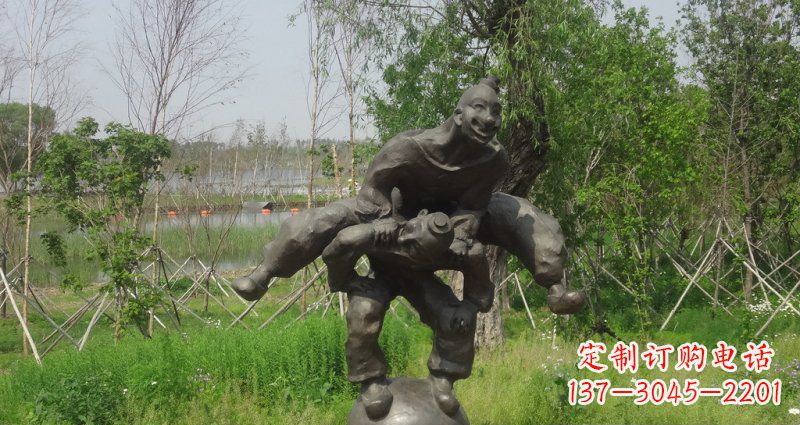 泰安园林站在球上面跳山羊的人物景观铜雕